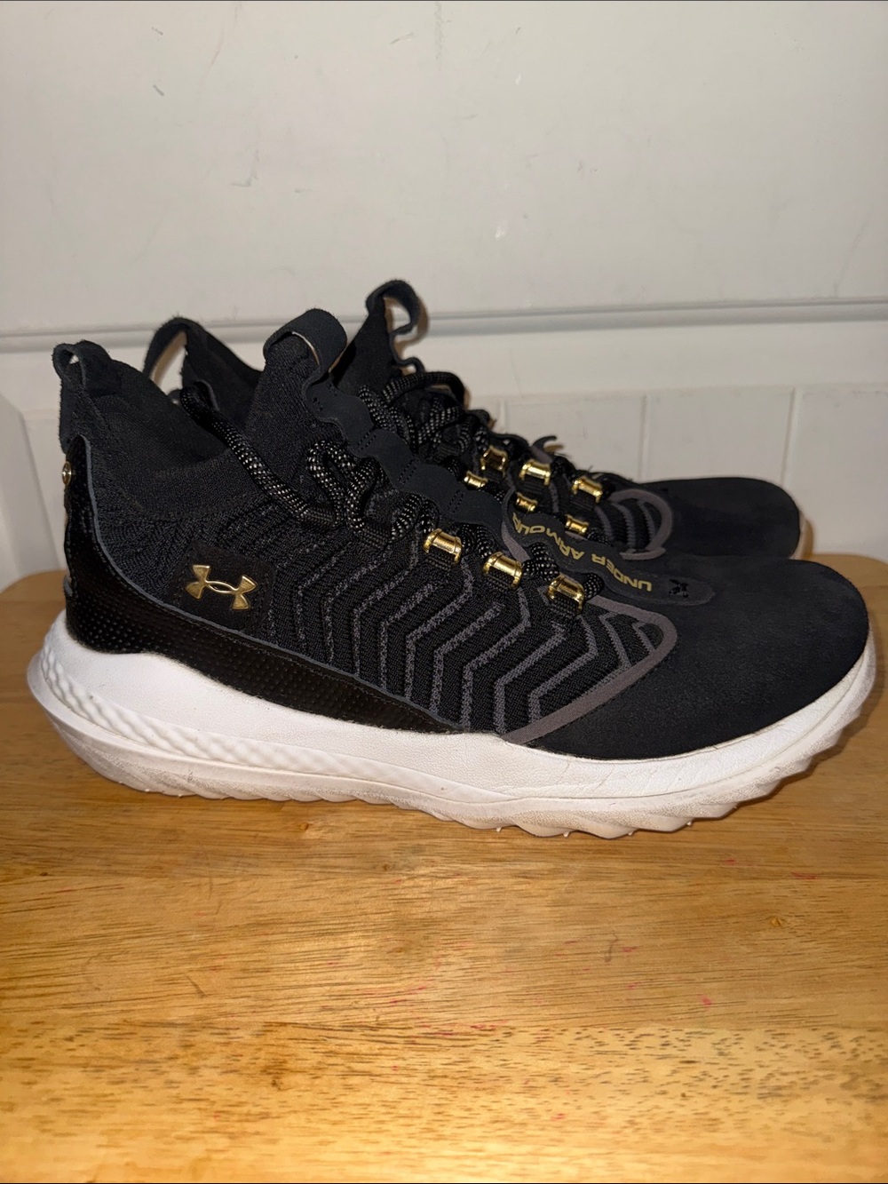 Under Armour Black Athletic Sneakers with Gold Accents